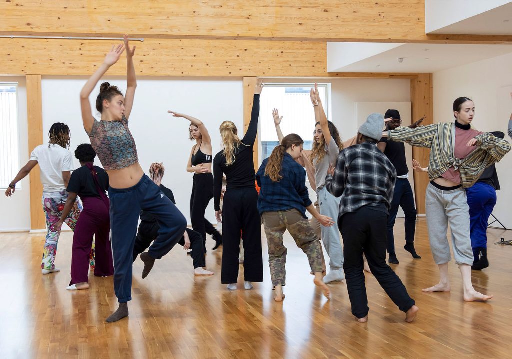 Multiple people dancing in a studio